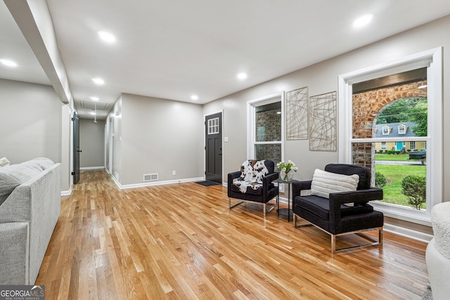 2771 Smithsonia Way, Tucker, GA 30084 - living area with attic access, light wood-style floors, recessed lighting, plenty of natural light, and baseboards
