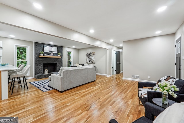 2771 Smithsonia Way, Tucker, GA 30084 - living area with light wood-style floors, a large fireplace, baseboards, and recessed lighting
