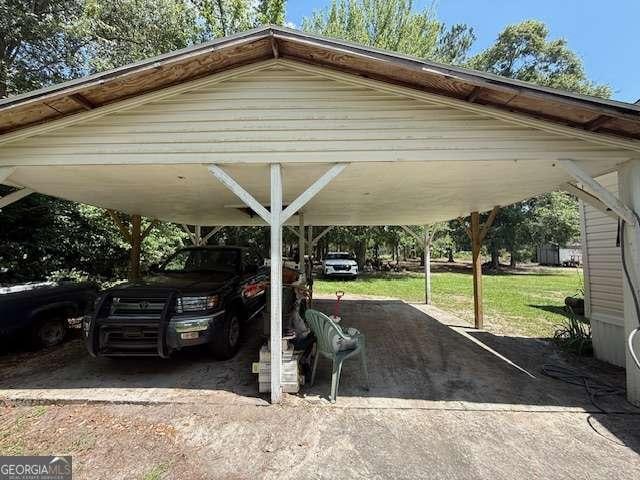 250 River Trce, Hahira, GA 31632 - view of parking / parking lot with a detached carport