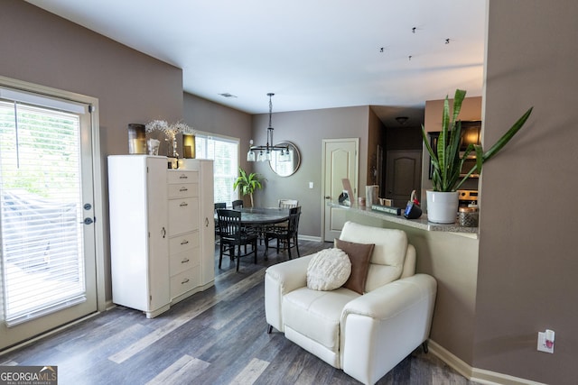 6813 Grand Hickory Dr, Braselton, GA 30517 - living room featuring a chandelier, wood finished floors, and baseboards