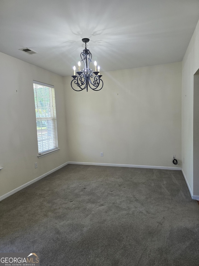 4677 Liberty Square Dr, Acworth, GA 30101 - unfurnished room with a chandelier and dark colored carpet