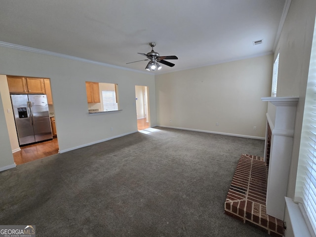 4677 Liberty Square Dr, Acworth, GA 30101 - unfurnished living room featuring ornamental molding, carpet floors, ceiling fan, and a fireplace