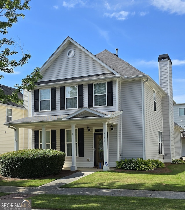 4677 Liberty Square Dr, Acworth, GA 30101 - view of front facade with a porch, a chimney, and a front lawn