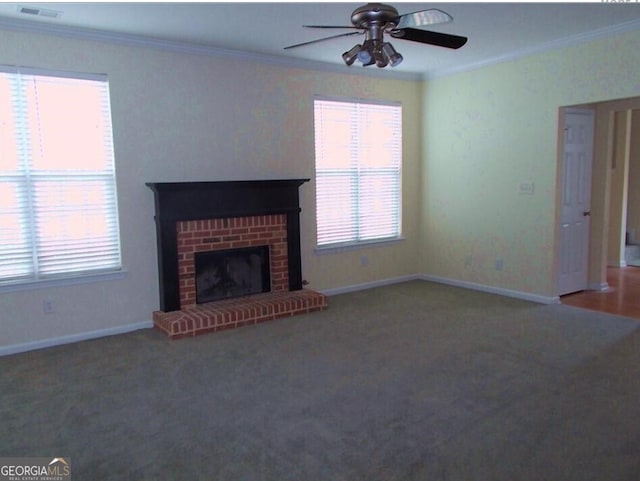 unfurnished living room featuring ornamental molding, ceiling fan, carpet floors, and healthy amount of natural light