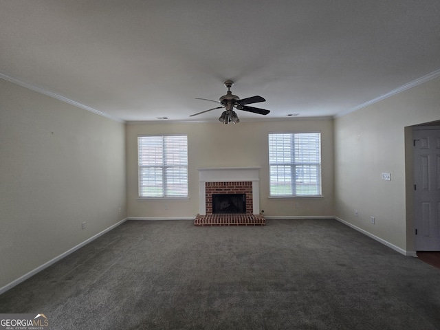 4677 Liberty Square Dr, Acworth, GA 30101 - unfurnished living room featuring crown molding, ceiling fan, dark colored carpet, and a brick fireplace