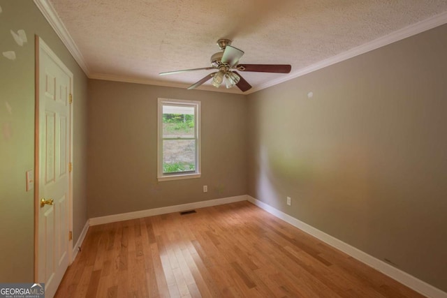 357 Camp Wahsega Rd, Dahlonega, GA 30533 - spare room with light wood-style floors, a textured ceiling, a ceiling fan, and crown molding