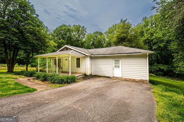 357 Camp Wahsega Rd, Dahlonega, GA 30533 - view of front of home with covered porch, asphalt driveway, and a front lawn