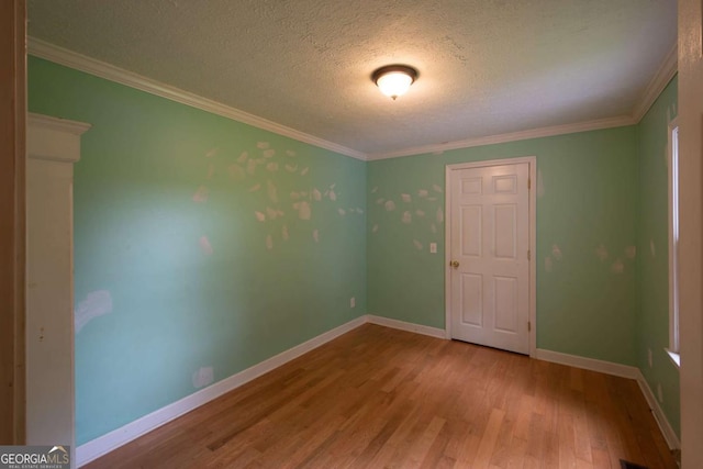 357 Camp Wahsega Rd, Dahlonega, GA 30533 - empty room featuring wood finished floors, a textured ceiling, and crown molding