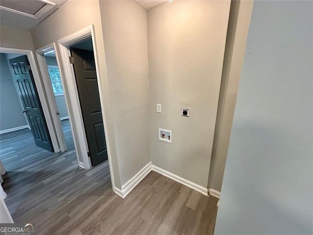 2489 Hillside Dr, Macon, GA 31206 - washroom with hookup for an electric dryer, wood finished floors, baseboards, and hookup for a washing machine