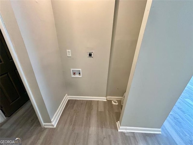 2489 Hillside Dr, Macon, GA 31206 - laundry room featuring electric dryer hookup, baseboards, wood finished floors, and hookup for a washing machine