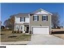 186 Pond Ct, Hoschton, GA 30548 - view of front facade with an attached garage and driveway