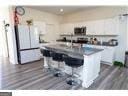 186 Pond Ct, Hoschton, GA 30548 - kitchen featuring wood finished floors