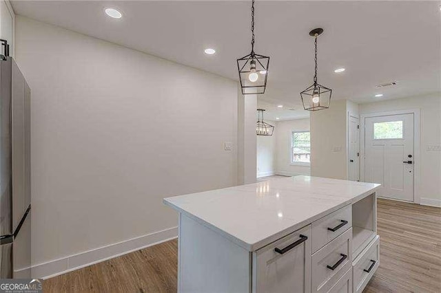 525 Rosemont Dr, Decatur, GA 30032 - kitchen featuring baseboards, light wood-style flooring, white cabinets, light countertops, and recessed lighting
