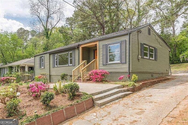525 Rosemont Dr, Decatur, GA 30032 - view of front of property featuring crawl space and view of wooded area