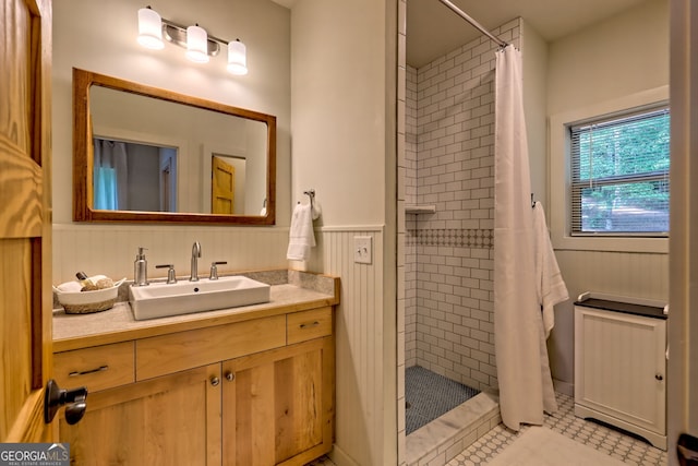 4610 Murray Cove Rd, Tiger, GA 30576 - bathroom with a tile shower, vanity, wainscoting, and tile patterned floors