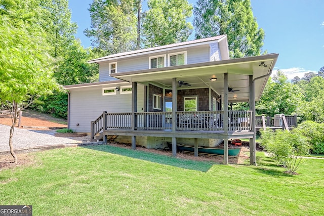 4610 Murray Cove Rd, Tiger, GA 30576 - view of front facade with ceiling fan, a front yard, and a deck
