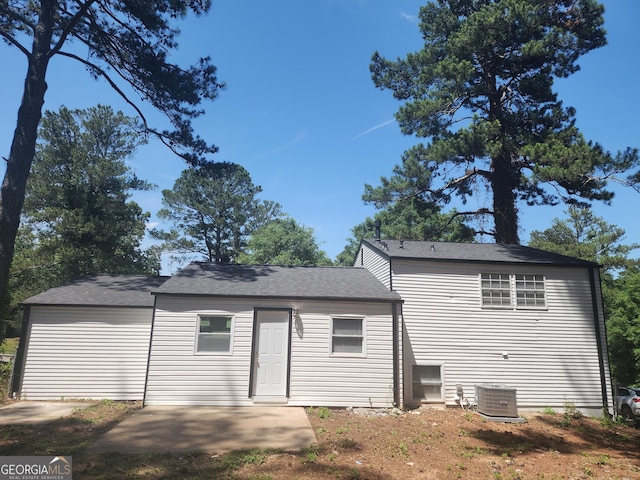 2615 Old S Ct, Jonesboro, GA 30236 - back of house with central air condition unit, a patio, and a shingled roof