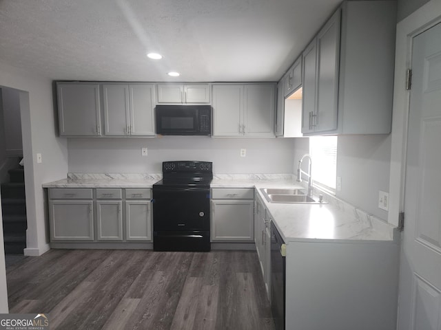 2615 Old S Ct, Jonesboro, GA 30236 - kitchen featuring black appliances, a sink, gray cabinets, dark wood-type flooring, and recessed lighting