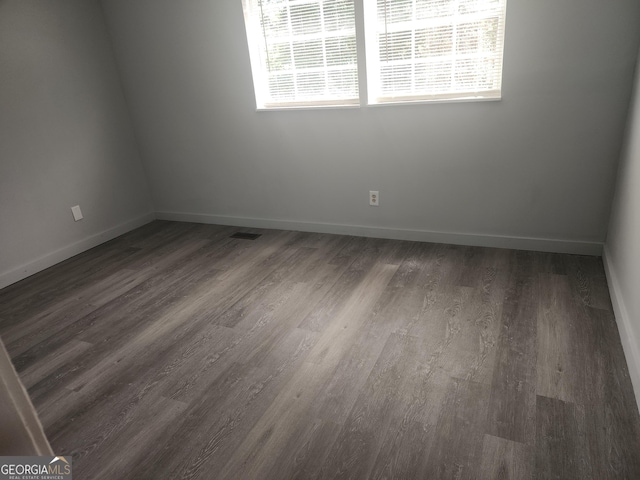 2615 Old S Ct, Jonesboro, GA 30236 - empty room featuring baseboards and dark wood-style floors