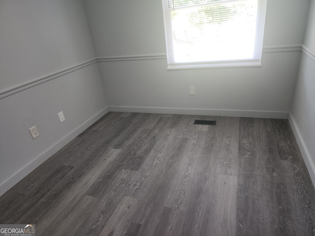 2615 Old S Ct, Jonesboro, GA 30236 - unfurnished room featuring wood finished floors and baseboards