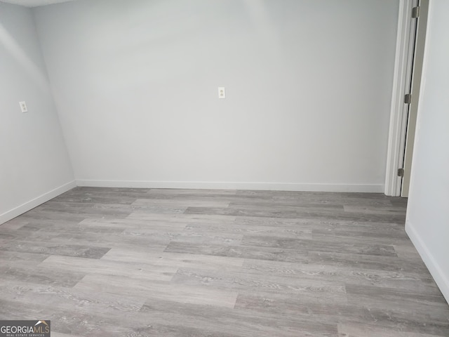 2615 Old S Ct, Jonesboro, GA 30236 - empty room with wood finished floors and baseboards