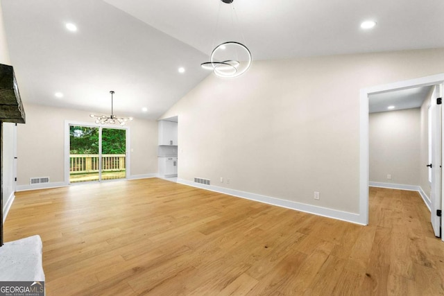 4043 Chedworth Way, Stone Mountain, GA 30083 - unfurnished living room featuring a chandelier, light wood-style floors, recessed lighting, baseboards, and high vaulted ceiling