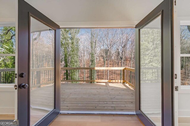 3110 Granada Way, Gainesville, GA 30506 - doorway with wood finished floors, plenty of natural light, and view of scattered trees