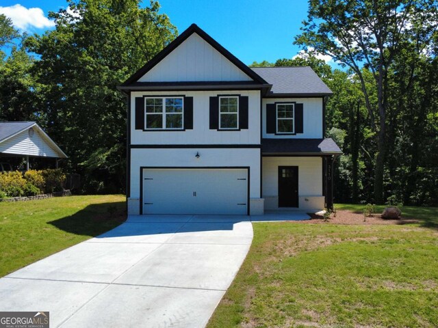 3110 Granada Way, Gainesville, GA 30506 - view of front facade featuring driveway, an attached garage, and a front lawn