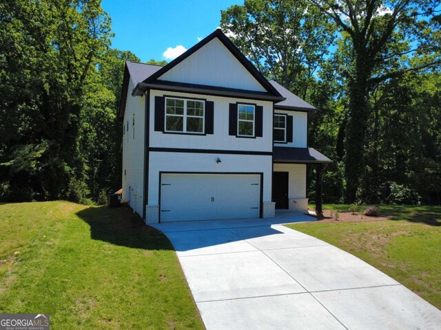 3110 Granada Way, Gainesville, GA 30506 - view of front facade with driveway, an attached garage, and a front lawn