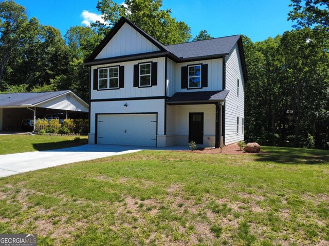 3110 Granada Way, Gainesville, GA 30506 - view of front facade with an attached garage, concrete driveway, a front yard, and board and batten siding