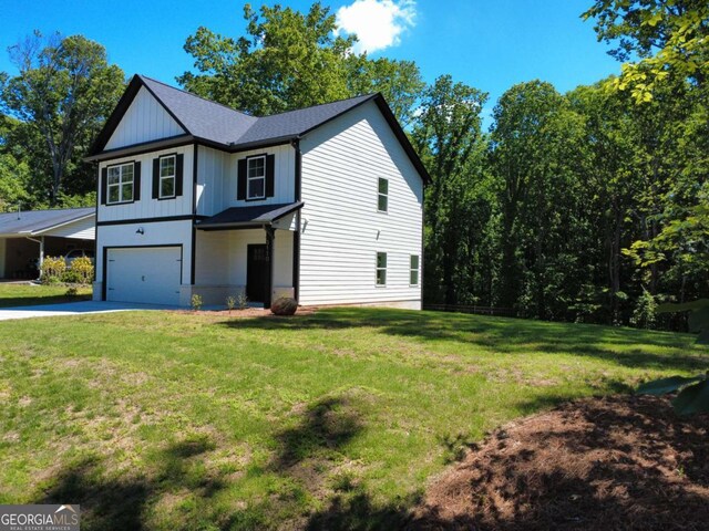 3110 Granada Way, Gainesville, GA 30506 - view of front facade with a garage, concrete driveway, board and batten siding, and a front yard
