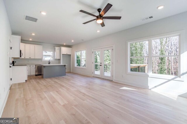 3110 Granada Way, Gainesville, GA 30506 - unfurnished living room featuring light wood-type flooring, ceiling fan, and recessed lighting