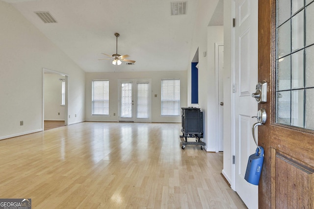 140 Shoal Creek Rd, Griffin, GA 30223 - foyer featuring a wood stove, a ceiling fan, lofted ceiling, light wood-style floors, and baseboards