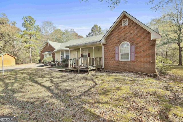 140 Shoal Creek Rd, Griffin, GA 30223 - single story home featuring a porch, brick siding, and an outbuilding