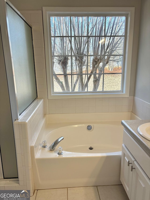 410 Oakpark Ter, Mcdonough, GA 30253 - bathroom featuring a bath, tile patterned floors, and vanity