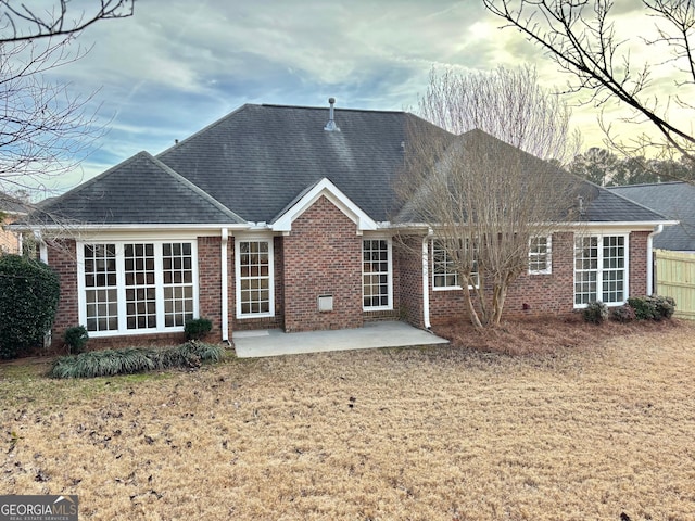 410 Oakpark Ter, Mcdonough, GA 30253 - rear view of house with a patio area, brick siding, and roof with shingles