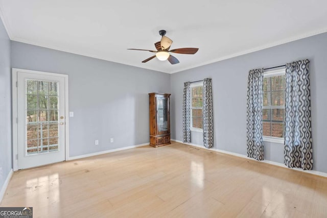 1645 Four Notch Rd, Carrollton, GA 30116 - spare room featuring a ceiling fan, wood finished floors, healthy amount of natural light, and ornamental molding