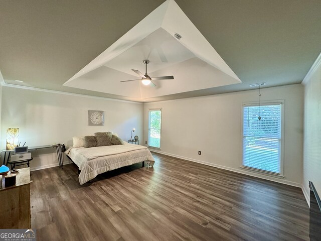 2610 Stokesley Way, Snellville, GA 30078 - bedroom featuring crown molding, a raised ceiling, dark wood finished floors, baseboards, and a ceiling fan