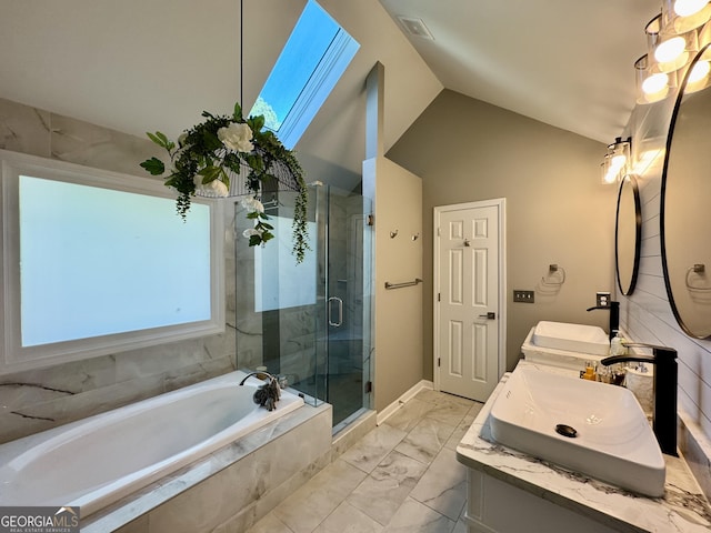 2610 Stokesley Way, Snellville, GA 30078 - bathroom featuring marble look tiles, double vanity, a bath, a stall shower, and lofted ceiling