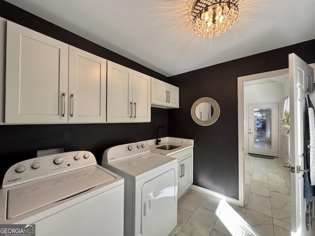 2610 Stokesley Way, Snellville, GA 30078 - washroom with light marble finish flooring, baseboards, washer and clothes dryer, and cabinet space