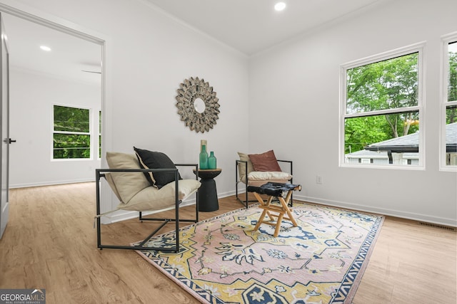 2926 5th St SW, Atlanta, GA 30315 - sitting room featuring crown molding, plenty of natural light, wood finished floors, baseboards, and recessed lighting