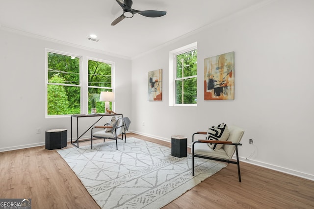 2926 5th St SW, Atlanta, GA 30315 - living area with crown molding, ceiling fan, wood finished floors, and baseboards