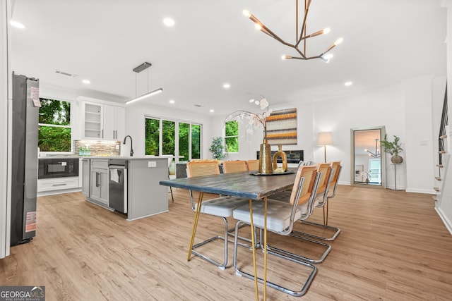 2926 5th St SW, Atlanta, GA 30315 - dining space featuring plenty of natural light, light wood-style floors, a chandelier, and recessed lighting