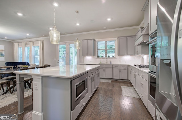 2657 Cedar Pine Way, Atlanta, GA 30360 - kitchen with stainless steel appliances, dark wood-style floors, gray cabinets, ornamental molding, and a center island