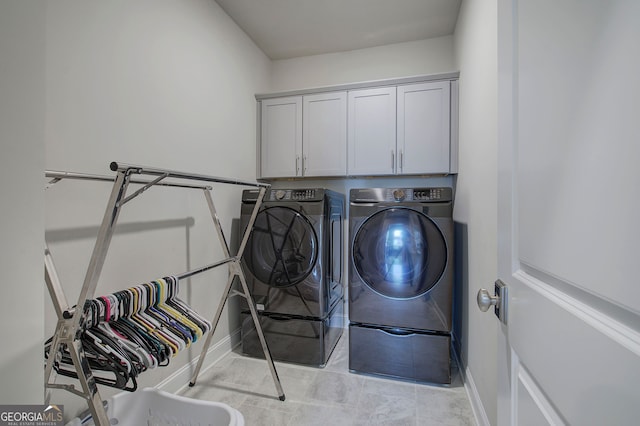2657 Cedar Pine Way, Atlanta, GA 30360 - laundry room featuring washer and dryer and cabinet space