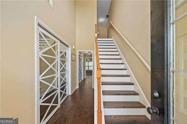 152 Maxton Ave, Dallas, GA 30132 - staircase featuring wood finished floors and a towering ceiling