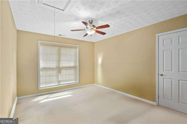 152 Maxton Ave, Dallas, GA 30132 - spare room with carpet floors, attic access, a ceiling fan, and a textured ceiling