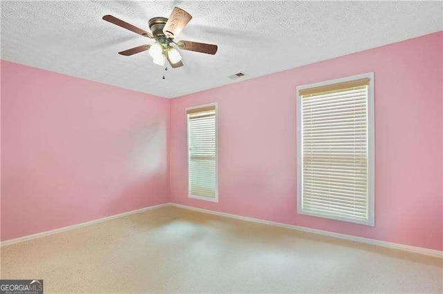 152 Maxton Ave, Dallas, GA 30132 - carpeted spare room with a ceiling fan and a textured ceiling