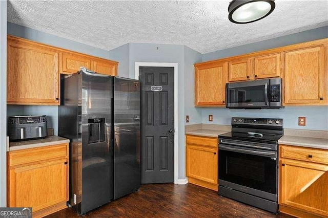 152 Maxton Ave, Dallas, GA 30132 - kitchen featuring electric range, black microwave, refrigerator with ice dispenser, dark wood-style flooring, and light countertops