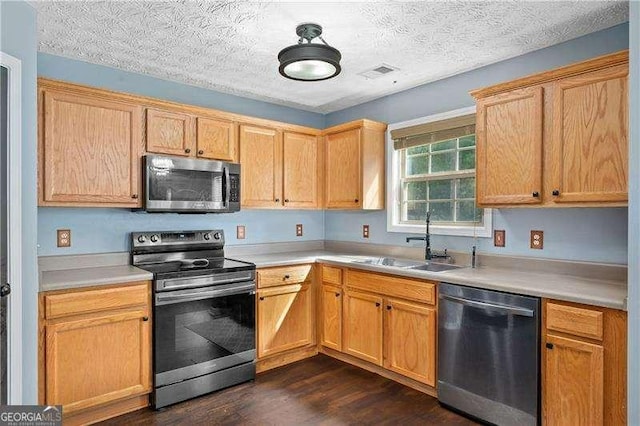 152 Maxton Ave, Dallas, GA 30132 - kitchen featuring appliances with stainless steel finishes, dark wood-style floors, light countertops, and a textured ceiling